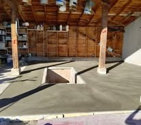 mecanics shop with concrete floor and concrete mechanics pit in the middle 